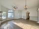Open living room with laminate flooring and large windows at 4423 E Ponca St, Phoenix, AZ 85044