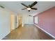 Large bedroom with wood-look floors and access to hallway bathroom at 4423 E Ponca St, Phoenix, AZ 85044