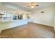 Modern kitchen featuring white cabinets, quartz countertops, and stainless steel appliances at 4423 E Ponca St, Phoenix, AZ 85044