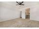 Bright bedroom with ceiling fan and en-suite bathroom access at 19031 W Palo Verde Dr, Litchfield Park, AZ 85340