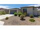 Single-story home with a two-car garage and desert landscaping at 19031 W Palo Verde Dr, Litchfield Park, AZ 85340