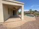 Covered patio adjacent to the pool area at 42468 W Palmyra Ln, Maricopa, AZ 85138