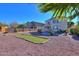 Large backyard with putting green and pool view at 42468 W Palmyra Ln, Maricopa, AZ 85138