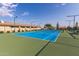 Well-maintained community tennis court with seating at 10908 E Olla Ave, Mesa, AZ 85212