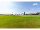 View of a well-maintained golf course with green grass and landscaping at 10908 E Olla Ave, Mesa, AZ 85212