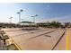 Community shuffleboard courts with seating areas at 10908 E Olla Ave, Mesa, AZ 85212