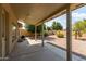 Covered patio overlooks a gravel backyard with desert landscaping at 10908 E Olla Ave, Mesa, AZ 85212