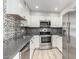 Modern kitchen with stainless steel appliances and stylish backsplash at 9275 E Mission Ln # 215, Scottsdale, AZ 85258