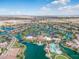 Aerial view of community with lake, pool, and homes at 41650 W Harvest Moon Dr, Maricopa, AZ 85138