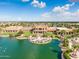 Aerial view of community center with lake and landscaping at 41650 W Harvest Moon Dr, Maricopa, AZ 85138