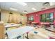 Art room with tables, easels, and storage cabinets at 41650 W Harvest Moon Dr, Maricopa, AZ 85138