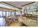 Community cafe with tables, chairs, and a coffee bar at 41650 W Harvest Moon Dr, Maricopa, AZ 85138