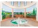 Relax in this hot tub with a scenic mural at 41650 W Harvest Moon Dr, Maricopa, AZ 85138