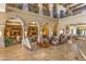 Elegant lobby with arched hallways and comfortable seating at 41650 W Harvest Moon Dr, Maricopa, AZ 85138
