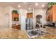 Kitchen boasts granite counters, stainless steel sink, and ample cabinetry at 6786 W Gelding Ln, Coolidge, AZ 85128