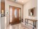 Welcoming entryway with decorative flooring and a console table at 6786 W Gelding Ln, Coolidge, AZ 85128