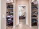 Hallway with built-in shelves and view into bedroom at 6786 W Gelding Ln, Coolidge, AZ 85128