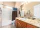 Clean bathroom, granite vanity, and bathtub shower combo at 6786 W Gelding Ln, Coolidge, AZ 85128