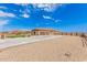 A large home with a three-car garage and expansive driveway at 6786 W Gelding Ln, Coolidge, AZ 85128