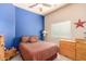 Cozy bedroom featuring a double bed and wood dresser at 6786 W Gelding Ln, Coolidge, AZ 85128