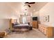 Large bedroom with king bed, fireplace, and built-in dresser at 6786 W Gelding Ln, Coolidge, AZ 85128