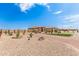 Landscaped front yard with desert plants and gravel at 6786 W Gelding Ln, Coolidge, AZ 85128