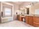 Large Primary bathroom with double vanity and soaking tub at 6786 W Gelding Ln, Coolidge, AZ 85128