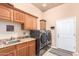 Laundry room with washer, dryer, and storage cabinets at 6786 W Gelding Ln, Coolidge, AZ 85128