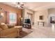 Spacious living room with tile floors and views into kitchen area at 6786 W Gelding Ln, Coolidge, AZ 85128
