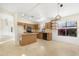 Open concept kitchen with granite countertops and an island at 36466 W Alhambra St, Maricopa, AZ 85138