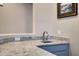 Convenient wet bar with granite countertop and a small sink at 41650 W Harvest Moon Dr, Maricopa, AZ 85138