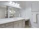 Bathroom boasts a large vanity, a walk-in shower, and updated fixtures at 41650 W Harvest Moon Dr, Maricopa, AZ 85138
