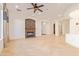 Living room with tile floor, stone fireplace and views to kitchen at 31811 N 16Th Ave, Phoenix, AZ 85085