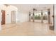 Living room featuring tile floors, large windows, and a fireplace at 31811 N 16Th Ave, Phoenix, AZ 85085