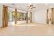 Living area with tile floors, large windows, and ceiling fan at 31811 N 16Th Ave, Phoenix, AZ 85085
