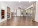 Living room showcasing hardwood floors, built-in shelving and fireplace at 31811 N 16Th Ave, Phoenix, AZ 85085