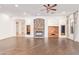 Spacious living room with hardwood floors, built-in cabinetry and fireplace at 31811 N 16Th Ave, Phoenix, AZ 85085