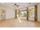 Living room with tile floors, large windows, and backyard access at 31811 N 16Th Ave, Phoenix, AZ 85085