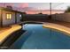 Beautiful kidney shaped pool with clean lines and a large backyard at 6040 W Hollyhock Dr, Phoenix, AZ 85033