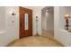 Bright entryway with circular tile floor and coat rack at 31811 N 16Th Ave, Phoenix, AZ 85085