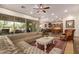 Spacious living room with large sectional sofa and view of kitchen at 31811 N 16Th Ave, Phoenix, AZ 85085