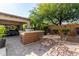 Outdoor kitchen area with seating for dining at 31811 N 16Th Ave, Phoenix, AZ 85085