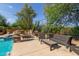 Relaxing poolside patio with seating and landscaping at 31811 N 16Th Ave, Phoenix, AZ 85085