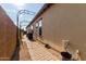 Neat side yard with brick pathway and landscaping at 31811 N 16Th Ave, Phoenix, AZ 85085