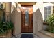 Elegant wood front door with glass accents at 31811 N 16Th Ave, Phoenix, AZ 85085