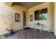 Small patio with bistro set and potted plants at 31811 N 16Th Ave, Phoenix, AZ 85085