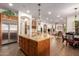 Large kitchen island with granite countertops and stainless steel appliances at 31811 N 16Th Ave, Phoenix, AZ 85085