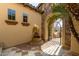 Inviting courtyard entry with fountain and wrought iron gate at 31811 N 16Th Ave, Phoenix, AZ 85085