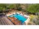 Large backyard pool with expansive patio and landscaping at 31811 N 16Th Ave, Phoenix, AZ 85085