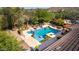 Multi-tiered pool with surrounding patio and landscaping at 31811 N 16Th Ave, Phoenix, AZ 85085